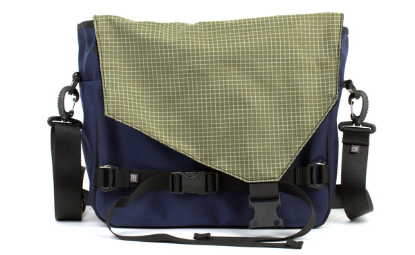 The Maker's Bag in Deep Blue (dark blue) 525 Ballistic with Taiga (olive green with white grid) 200 Halcyon interior.